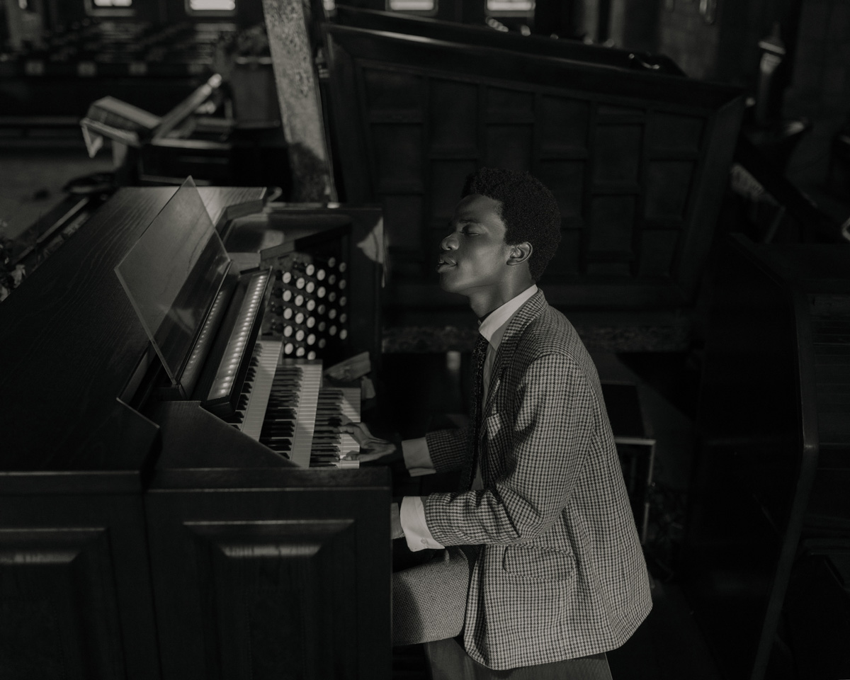 Photo of a man playing the piano in a church in Ghana